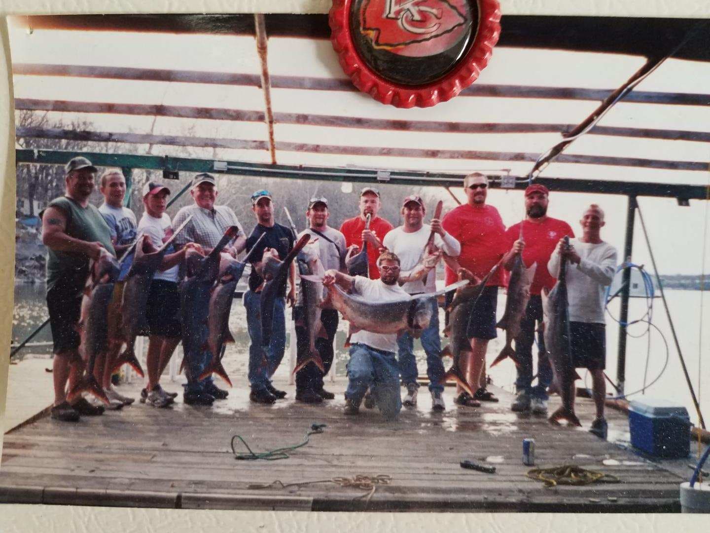 Spring spoonbill catch on the dock